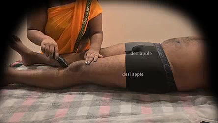 Asian aunty removing hair for young boy