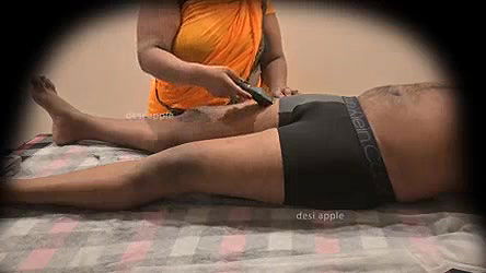 Asian aunty removing hair for young boy