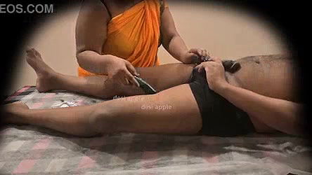 Asian aunty removing hair for young boy