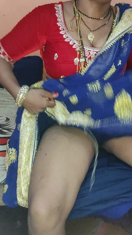 Left sister-in-law of Indian village in Lal Saari, left aunty of Indian village in Lal Sari