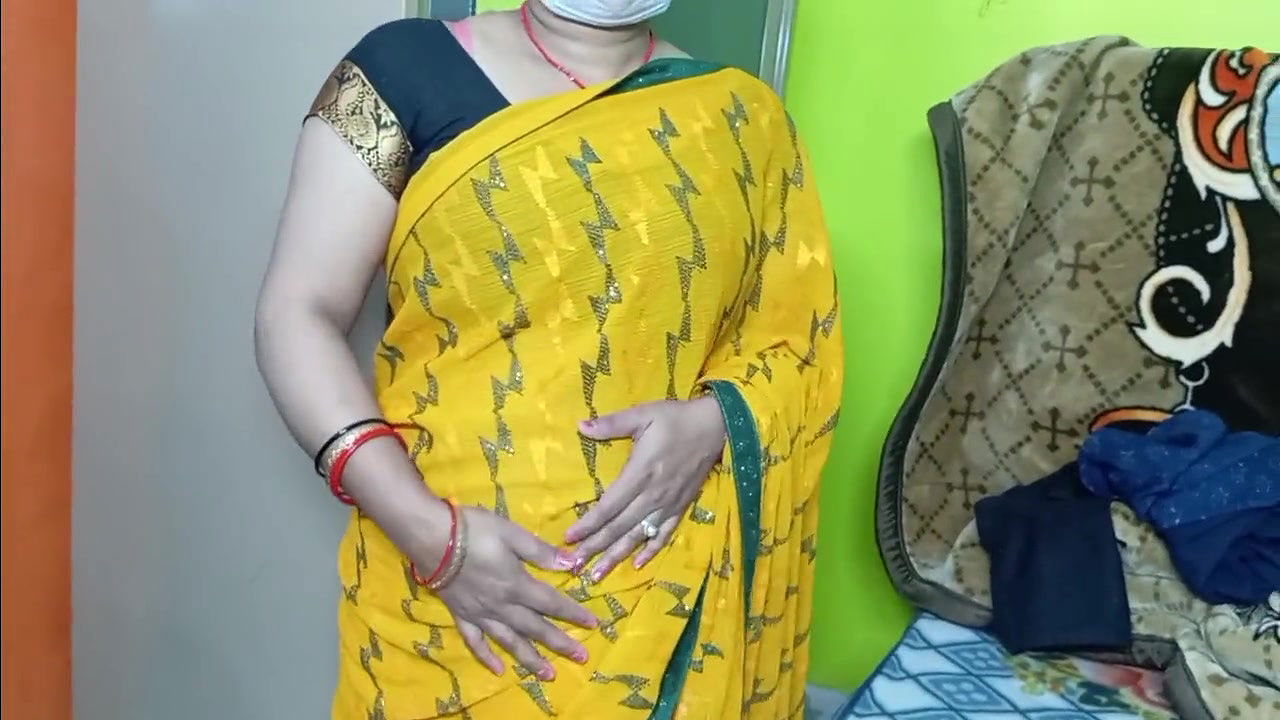 Beautiful bhabhi wearing yellow sari
