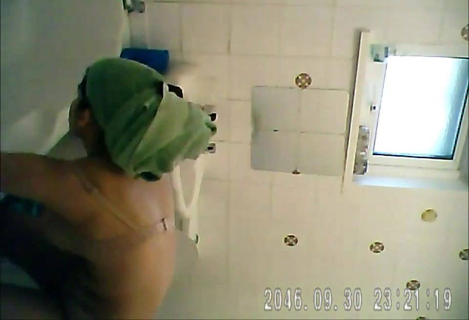 big boob babe cleaning bathroom andhower 2