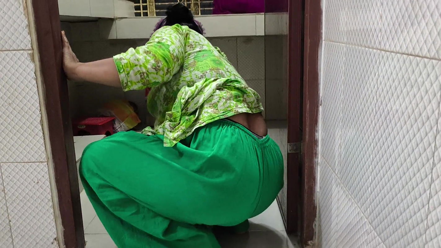 I suddenly see my aunty cleaning the dishes in the house