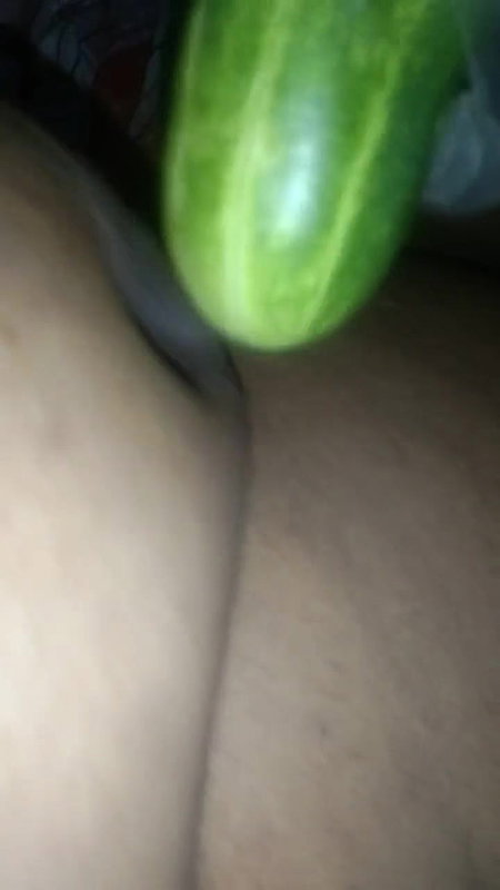 Busty slut inserts cucumber in her cunt