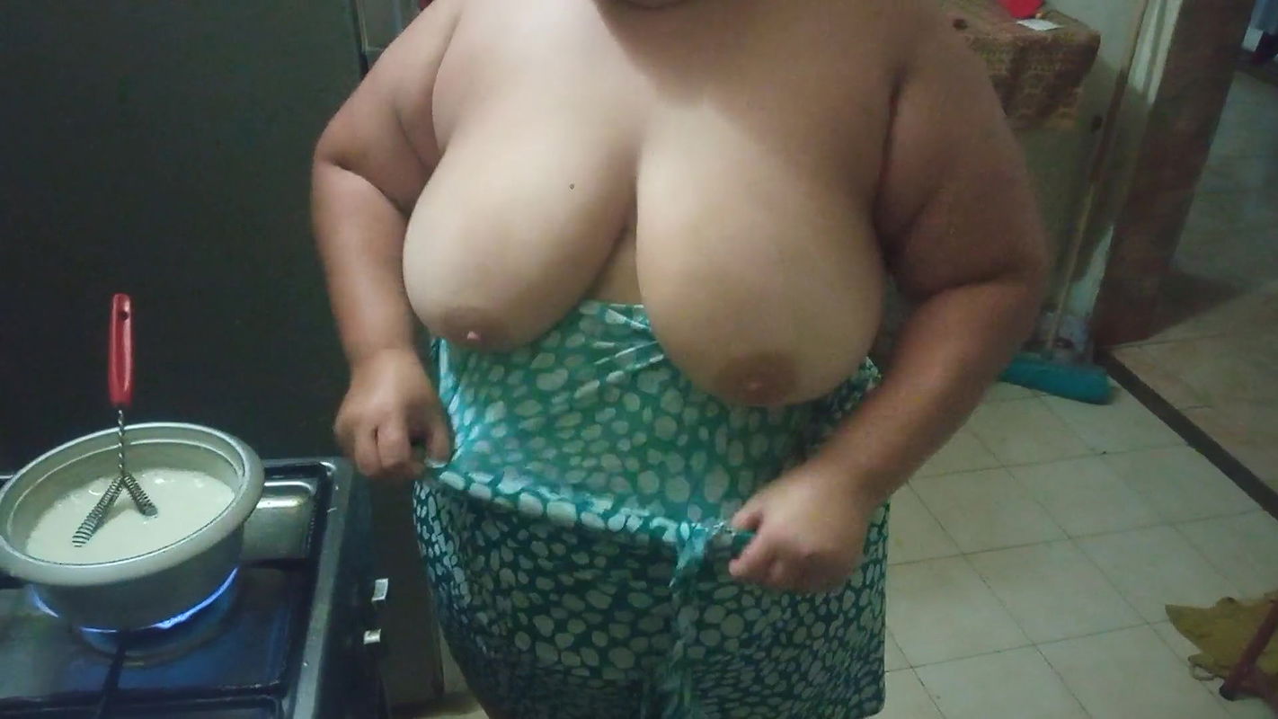 chubby stepmother in the kitchen preparing a delicious dinner
