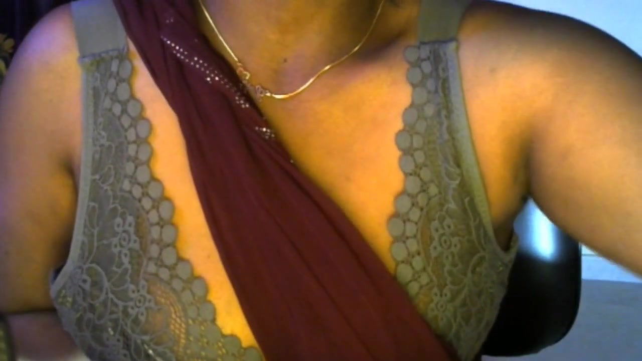 Desi Hindi sexy bhabhi enjoys live sex by pressing her boobs and becoming nude