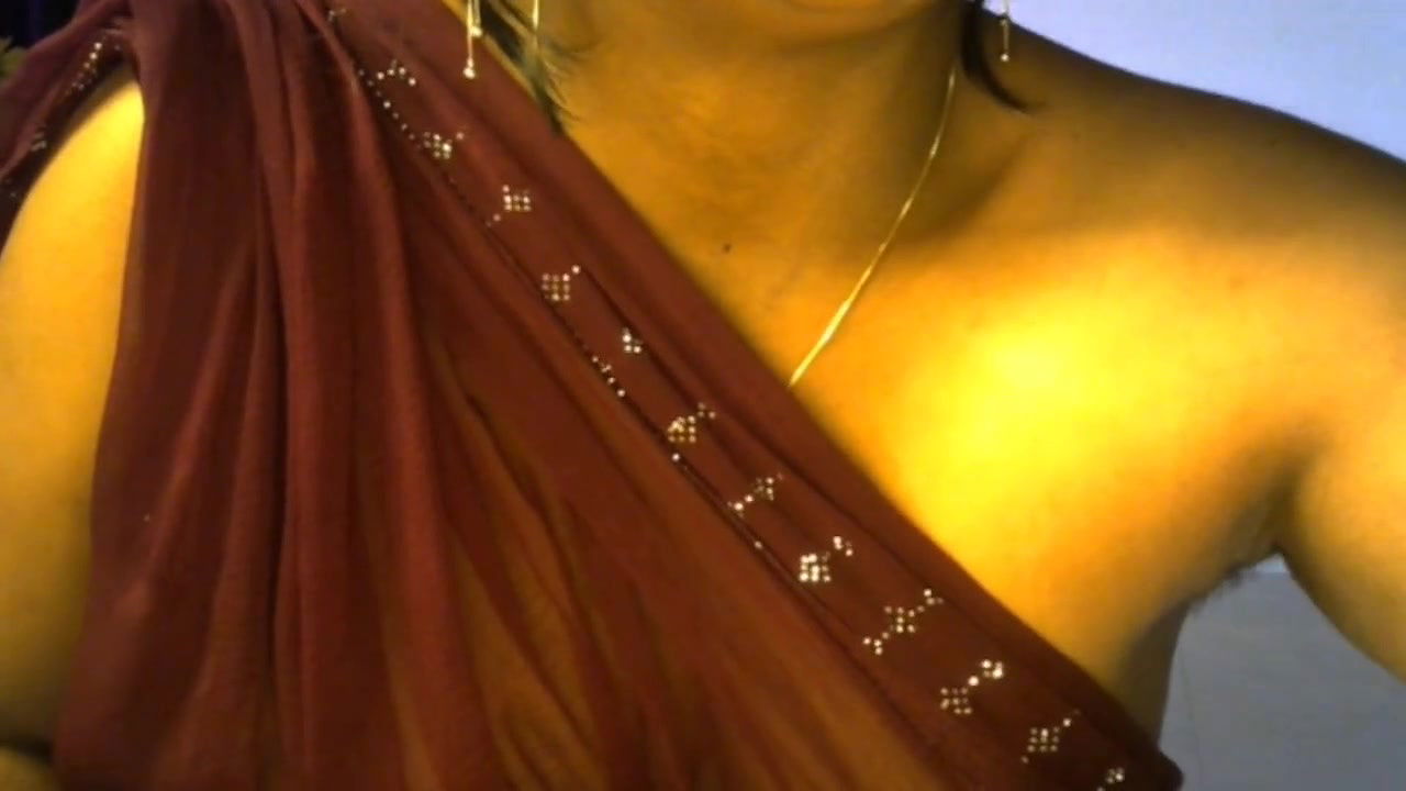 Desi Hindi sexy bhabhi enjoys live sex by pressing her boobs and becoming nude