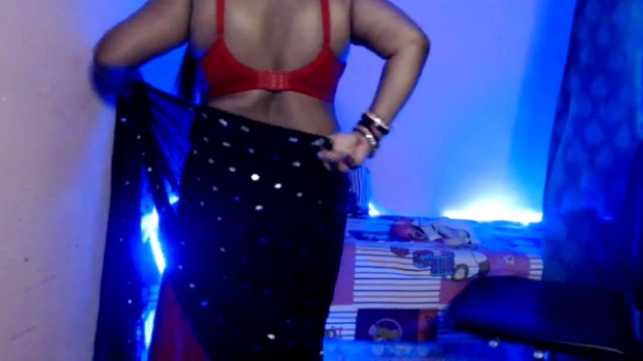 Desi Bhabhi slowly removes her clothes, exposes her sexy boobs and does self sex and does hot pussy fingering