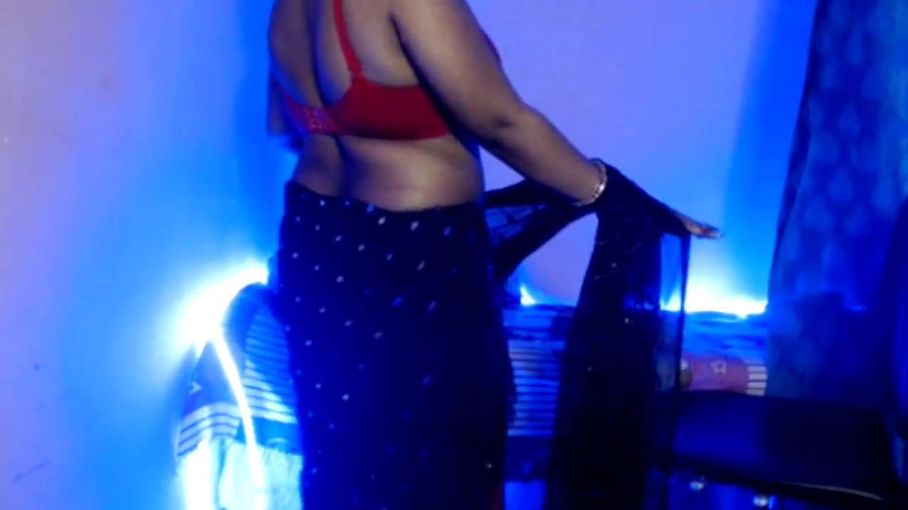 Desi Bhabhi slowly removes her clothes, exposes her sexy boobs and does self sex and does hot pussy fingering