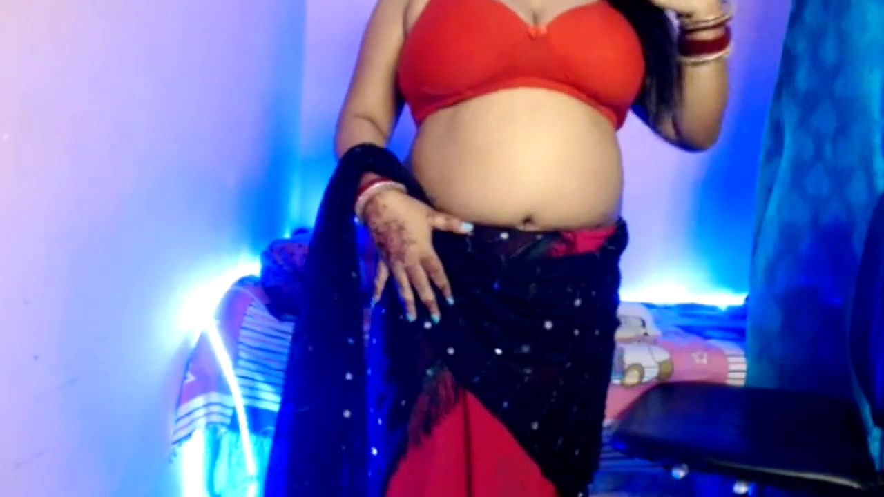 Desi Bhabhi slowly removes her clothes, exposes her sexy boobs and does self sex and does hot pussy fingering