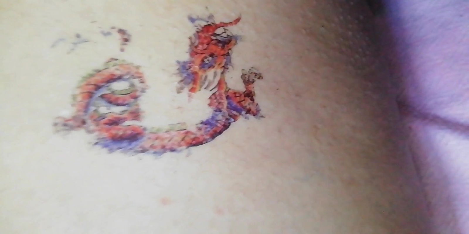 dragon tattoo on thigh near pussy