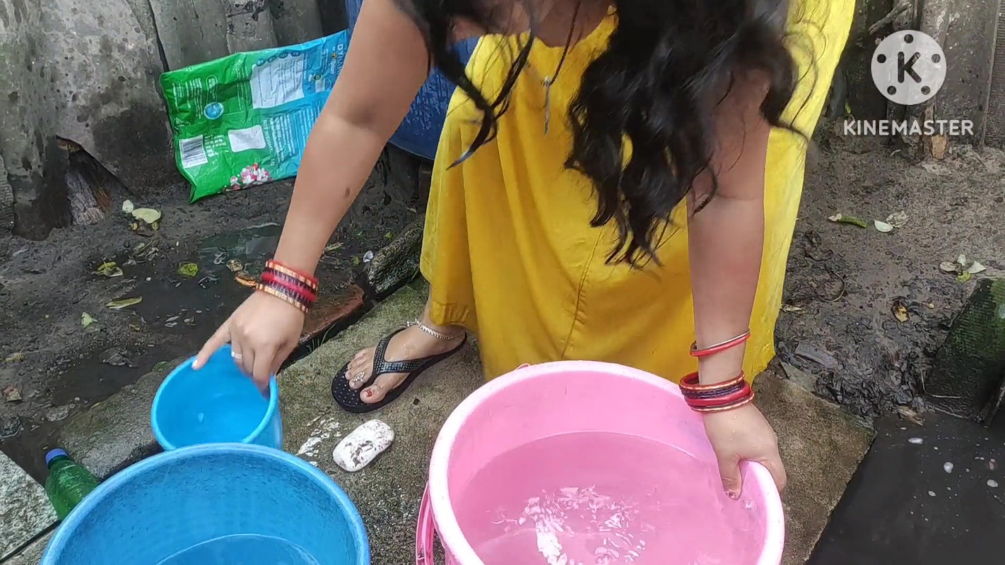 Indian bhabhi bathing outside with