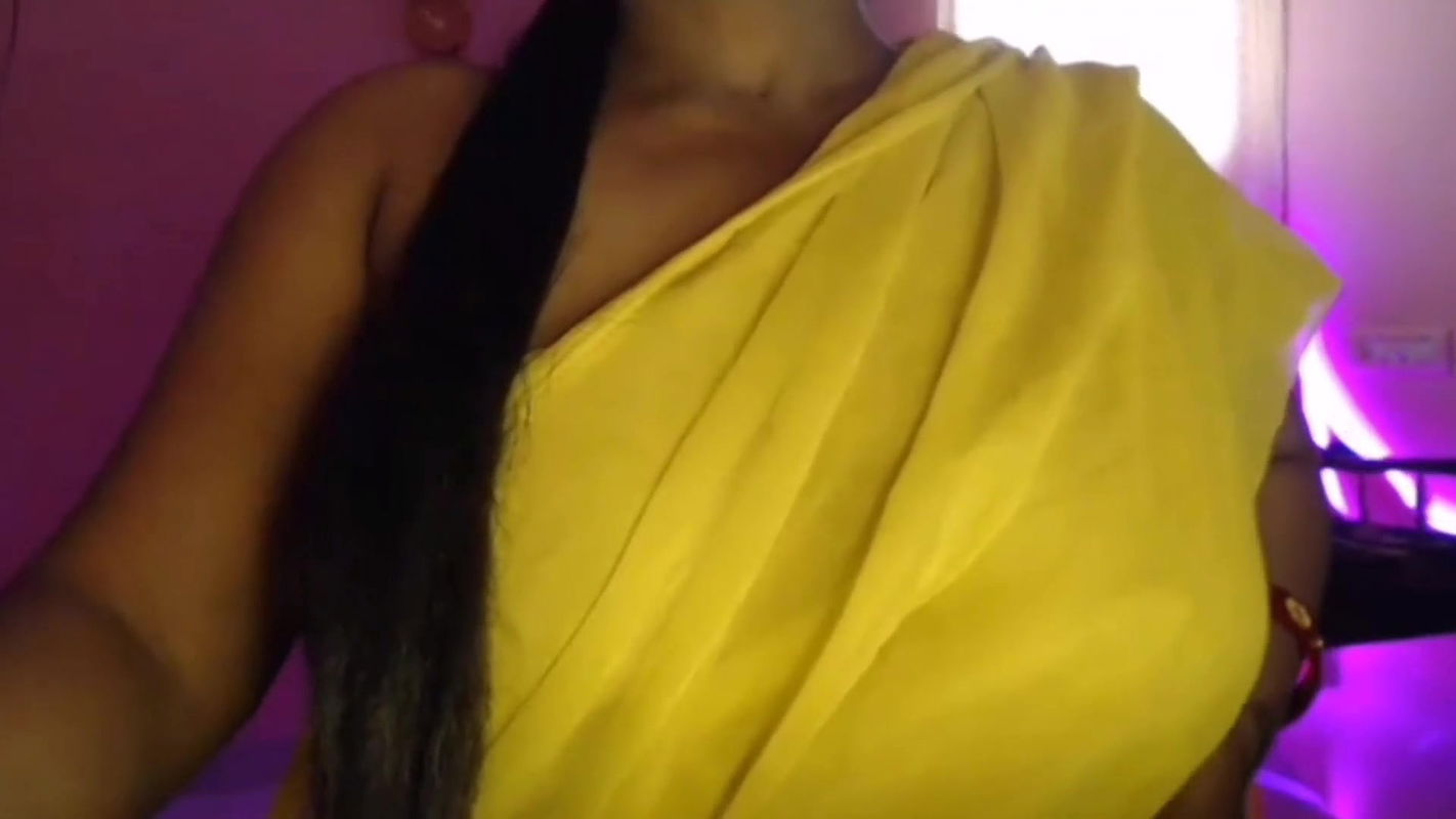 Hot Bhabhi pressed her boobs and gently pinched her nipples while opening her bra