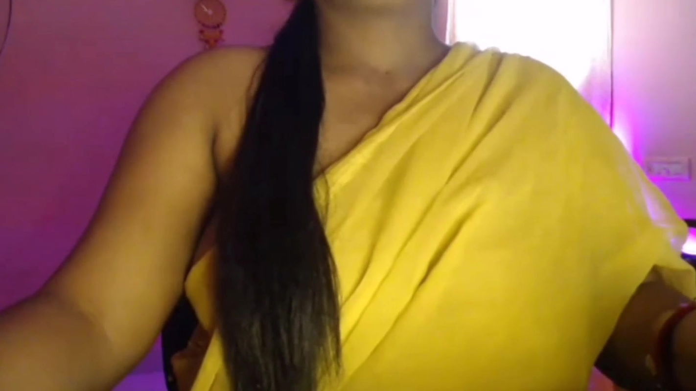 Hot Bhabhi pressed her boobs and gently pinched her nipples while opening her bra