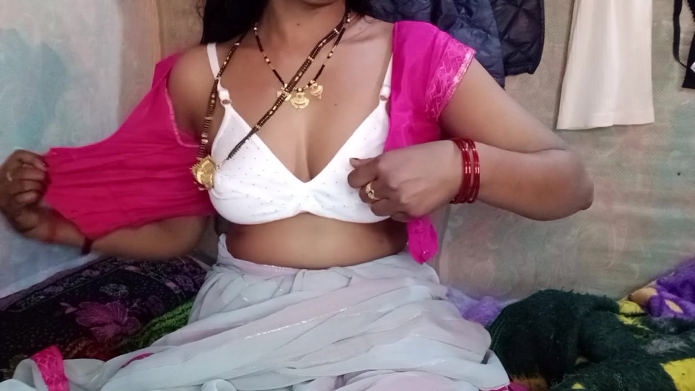 Hot Indian aunty pressed her big tits and got great pleasure by massaging her step son’s penis
