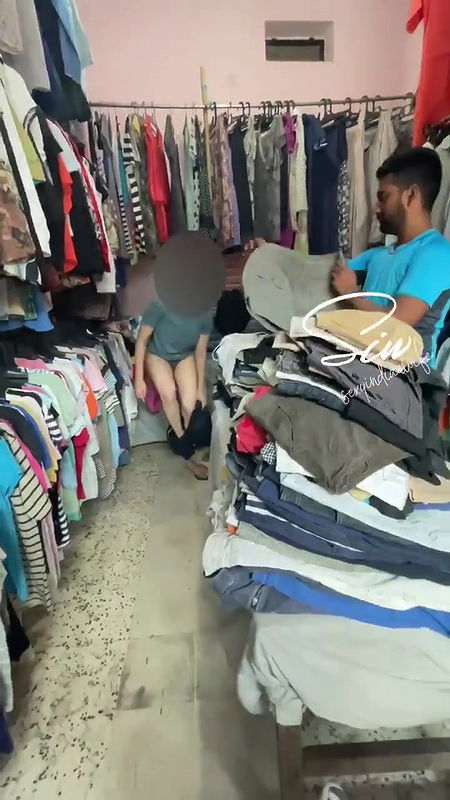Changing Dress in Front of Shopkeeper