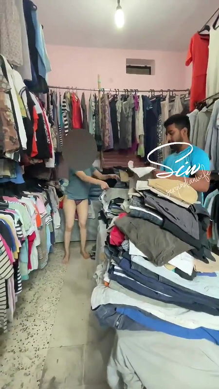 Changing Dress in Front of Shopkeeper