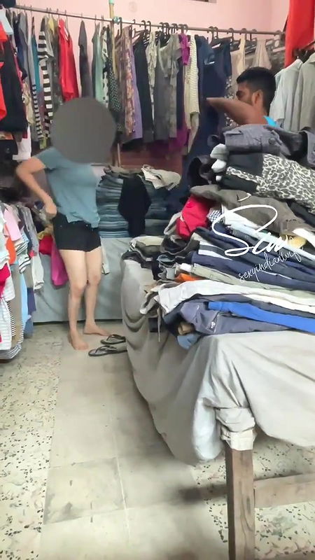 Changing Dress in Front of Shopkeeper