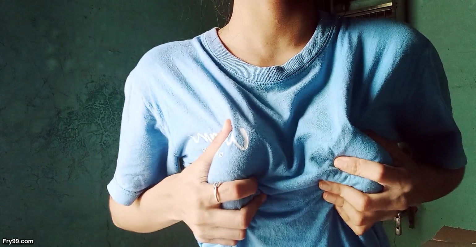 Lonely girl looking at her tits