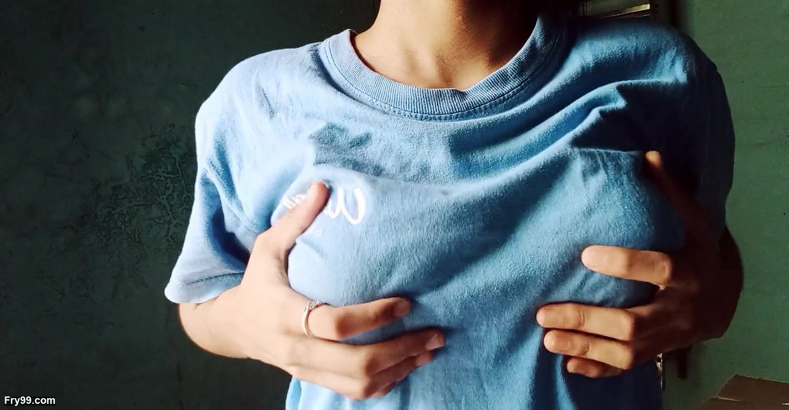 Lonely girl looking at her tits