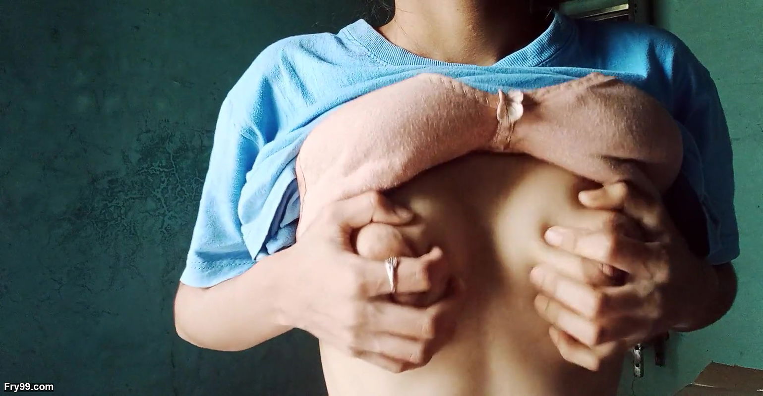 Lonely girl looking at her tits