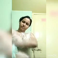 In bathroom, bathing