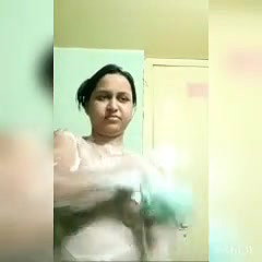 In bathroom, bathing