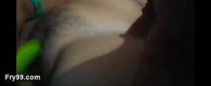 The hot girl took off all the clothes from her body and got naked and spread her legs and tried to insert the thick cucumber int