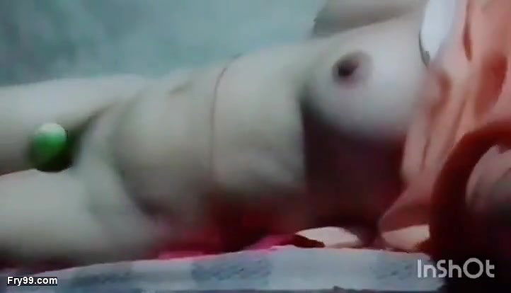 The cucumber is calming her lust with great enthusiasm