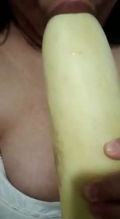 Horny girl sucking cucumber