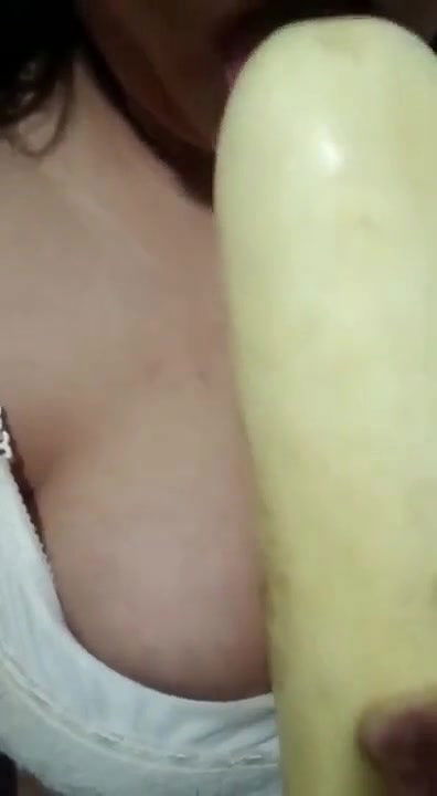 Horny girl sucking cucumber