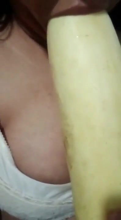 Horny girl sucking cucumber
