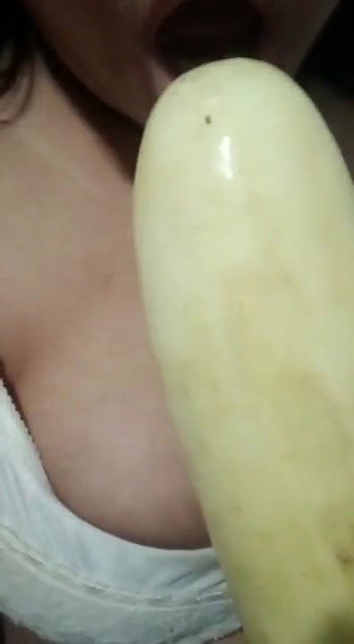 Horny girl sucking cucumber