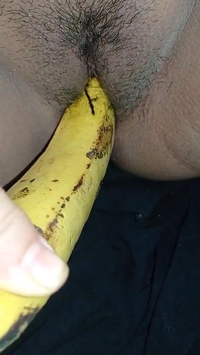 Indian girl playing with banana