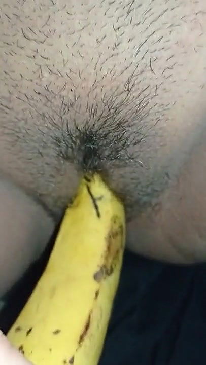 Indian girl playing with banana