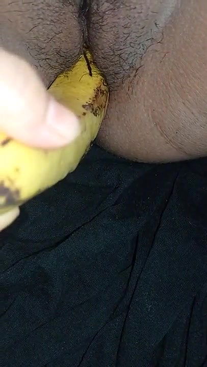 Indian girl playing with banana