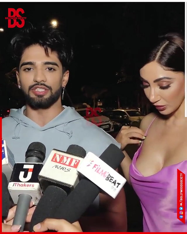 intentionally lower her dress and shows her big and oily cleavage,,