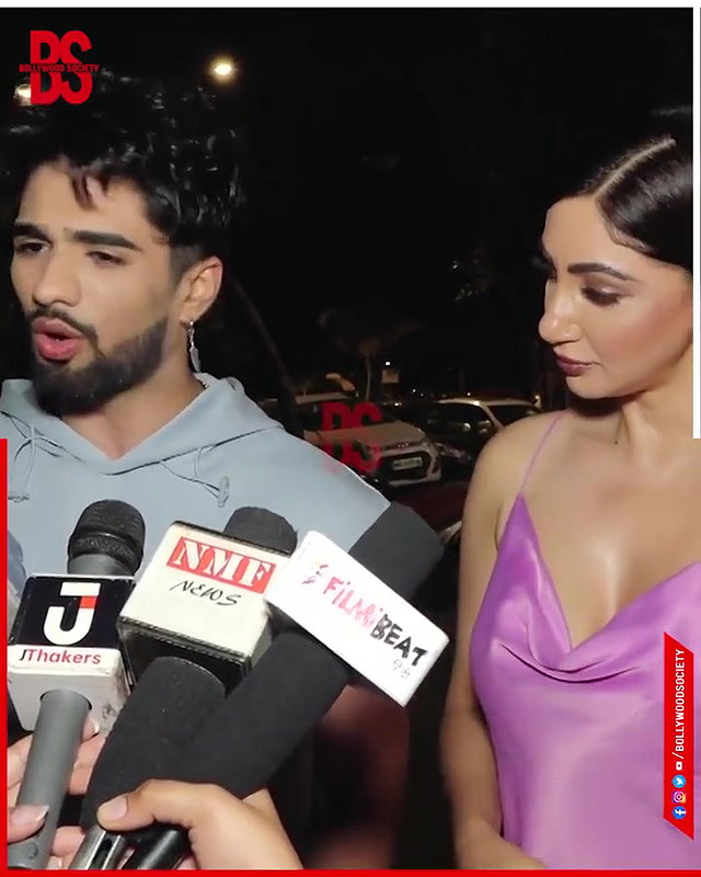 intentionally lower her dress and shows her big and oily cleavage,,