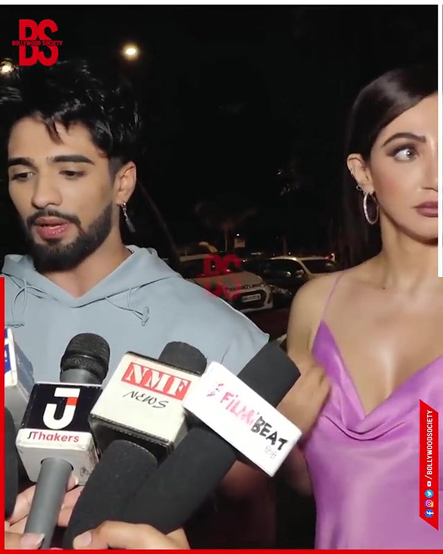 intentionally lower her dress and shows her big and oily cleavage,,