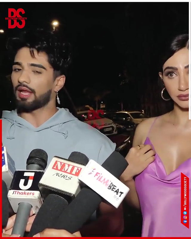 intentionally lower her dress and shows her big and oily cleavage,,