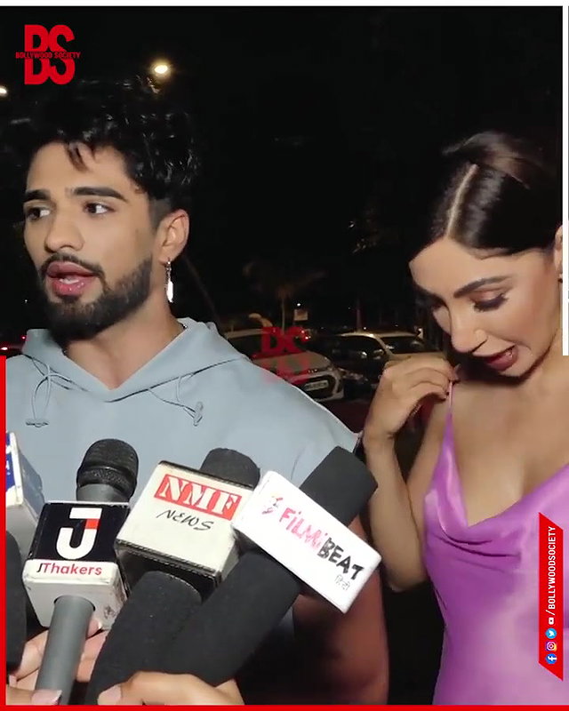 intentionally lower her dress and shows her big and oily cleavage,,