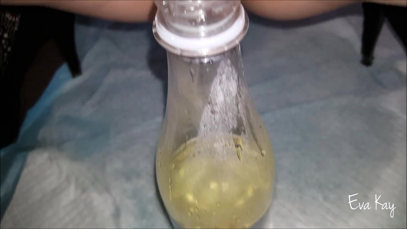 a kay Peeing in a bottle