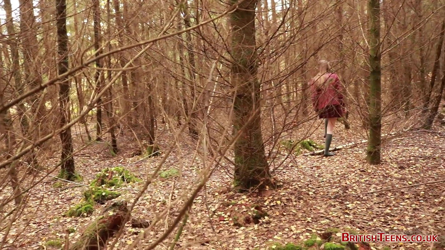 she is walking through the woods and pees with her