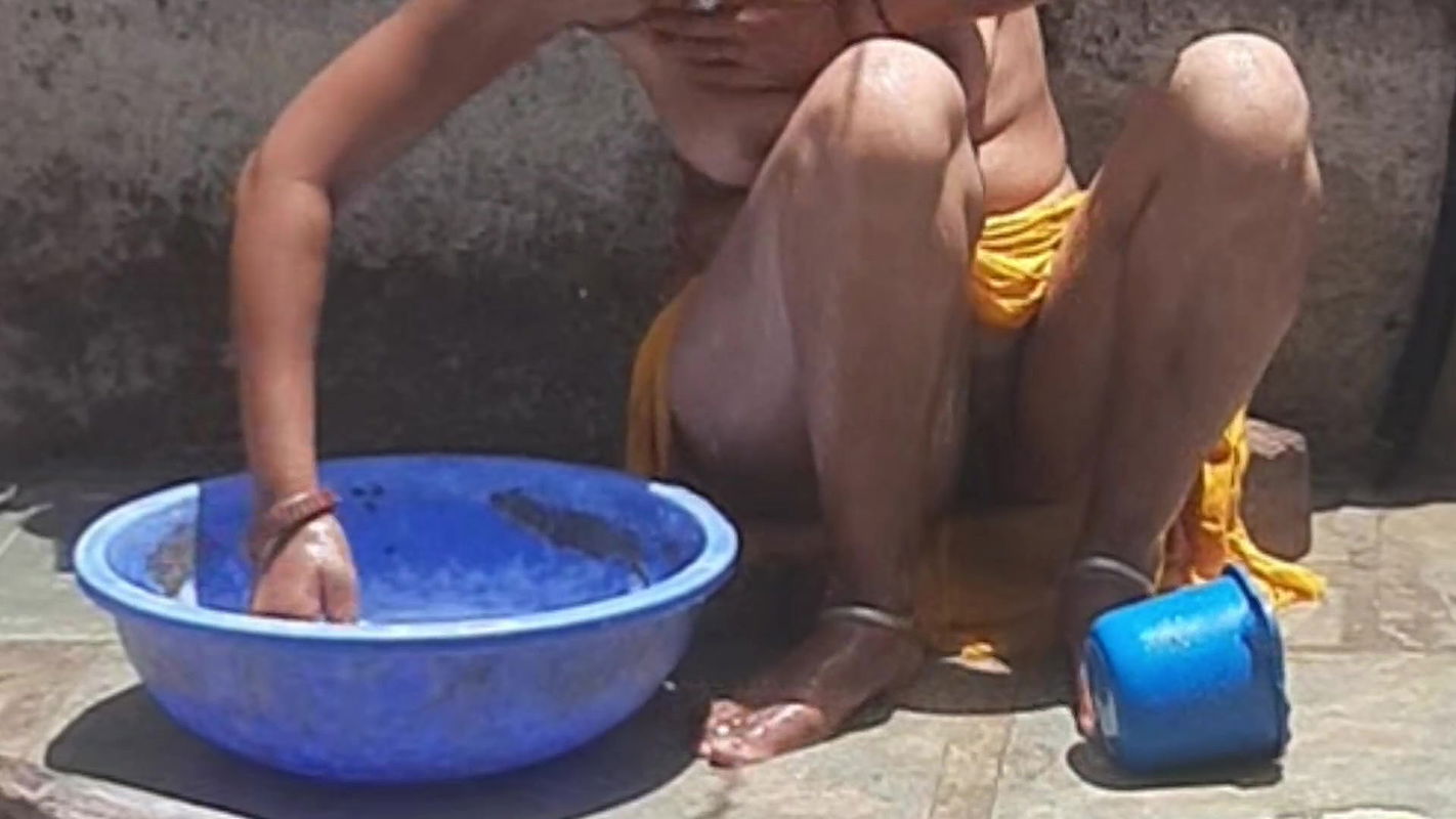 Desi stepsister is taking a bath in the open bathroom, undressing and showing beautiful head body, stepbrother is seen bathing stepbrother in the open bathroom