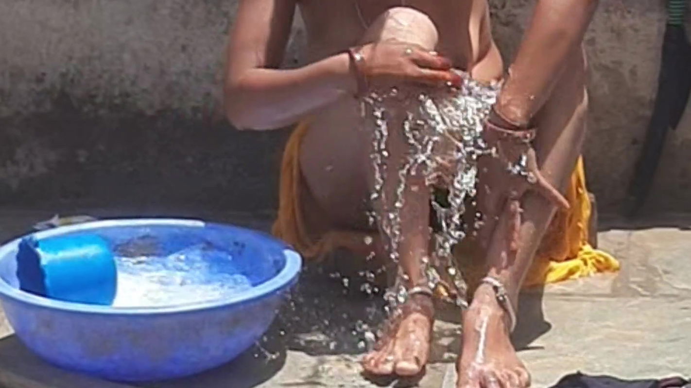 Desi stepsister is taking a bath in the open bathroom, undressing and showing beautiful head body, stepbrother is seen bathing stepbrother in the open bathroom