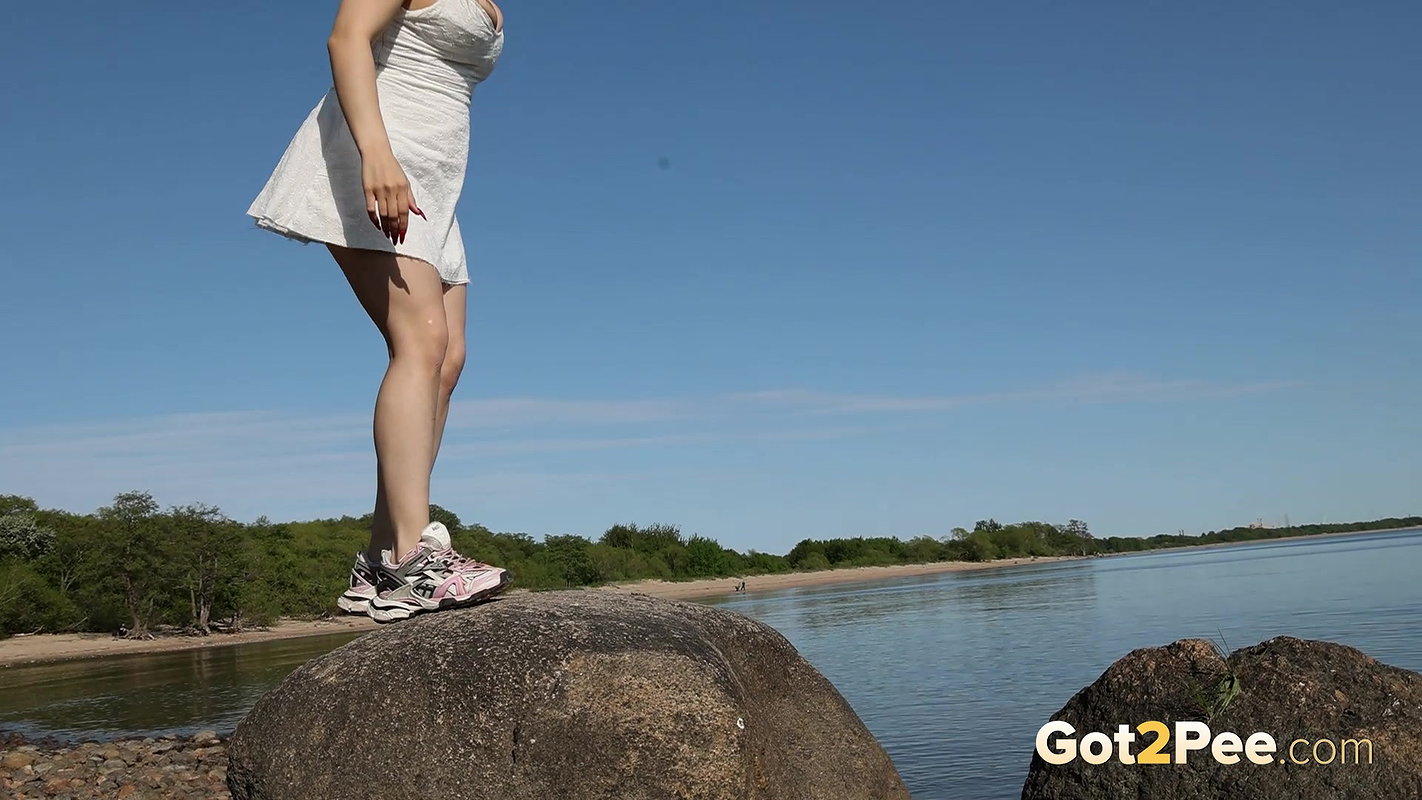 Brunette Babe Climbs Onto A Rock To Piss Outside Got2pee