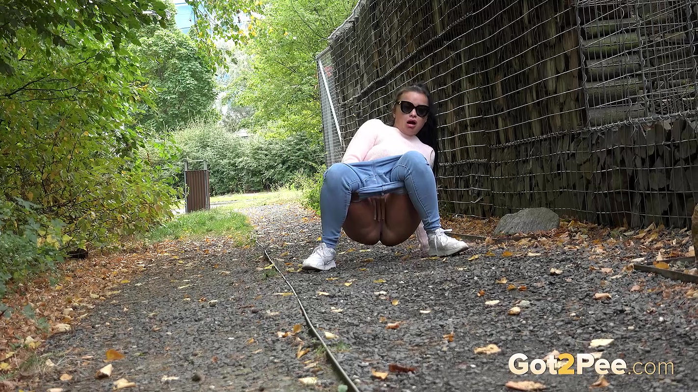 Dark Haired Babe Dafne Relieves Herself Outside Got2pee