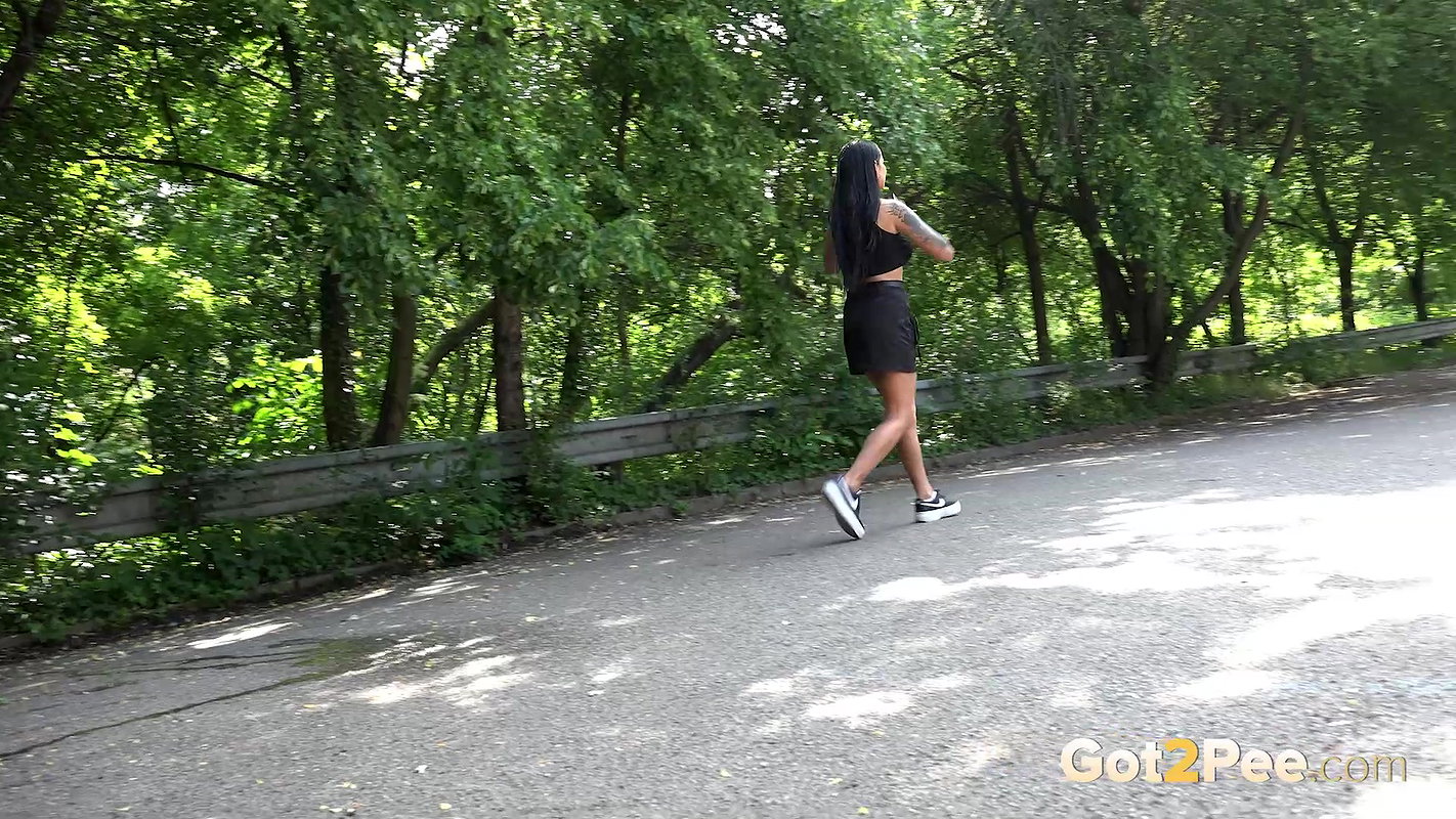 Maddi Black Squats And Pees Over The Road Got2pee