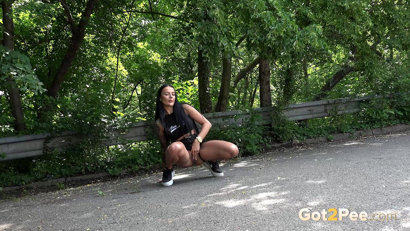 Maddi Black Squats And Pees Over The Road Got2pee