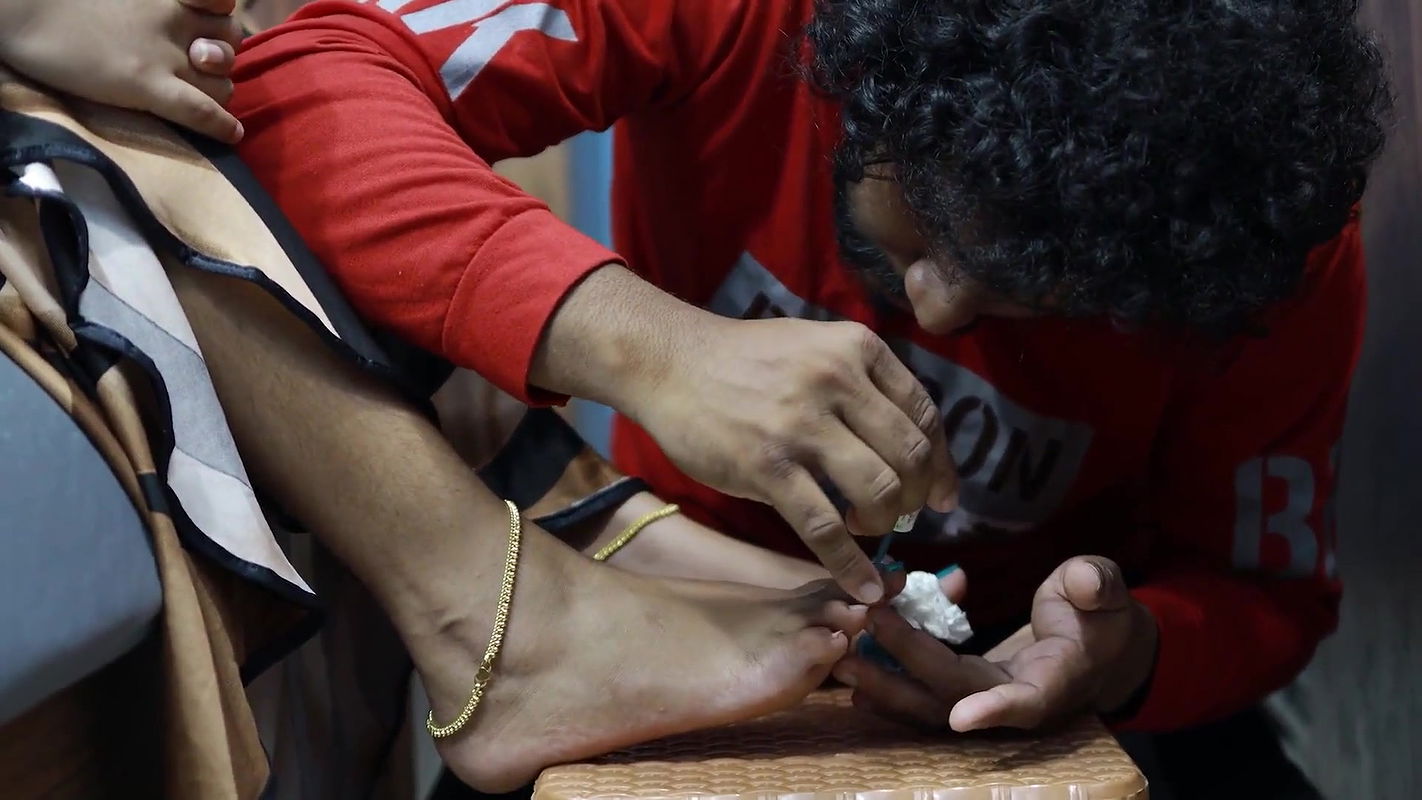 Boy Put Nail Polish on Girl Feet